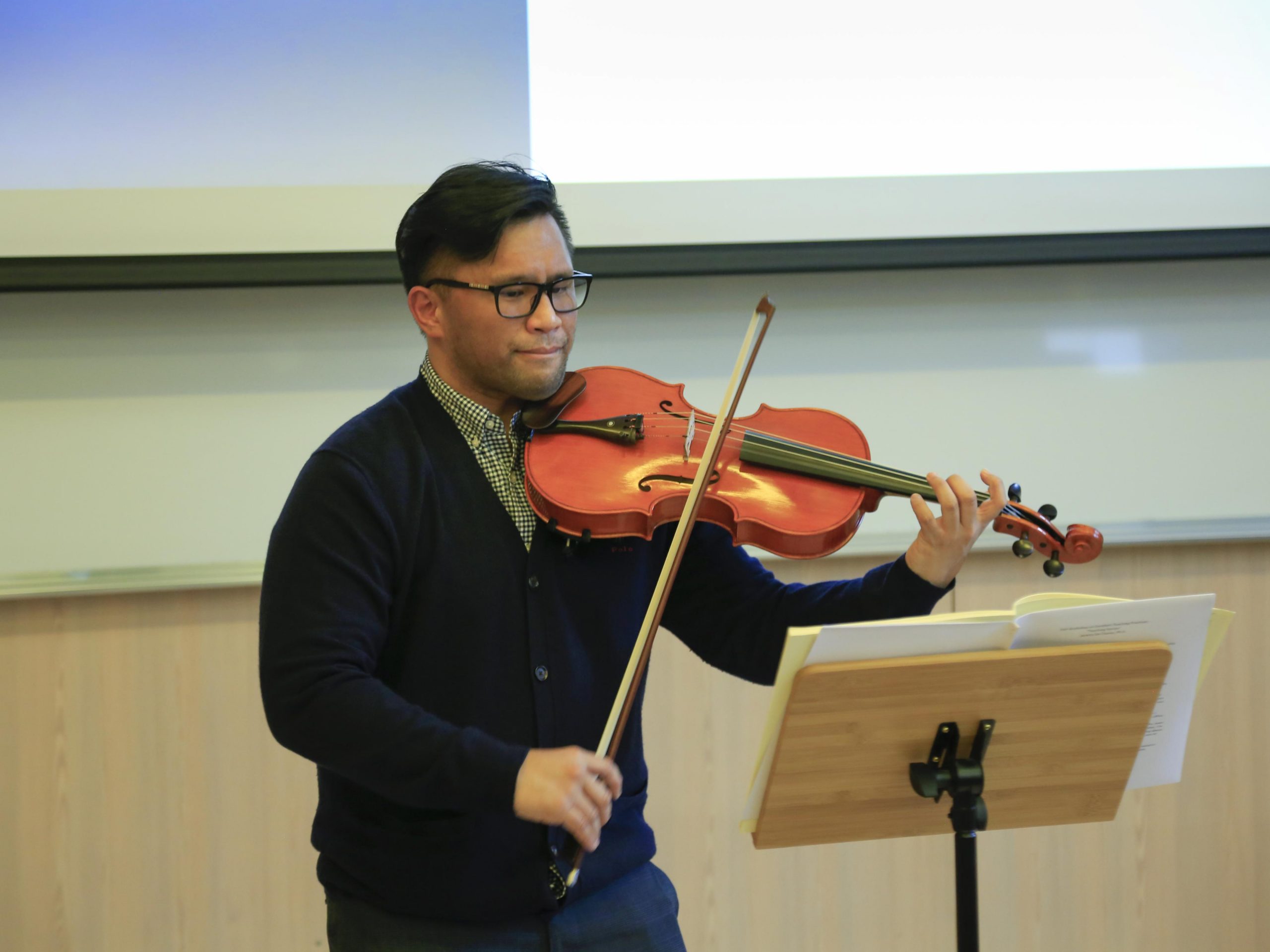 Prof Jeremy De Chavez plays a viola
