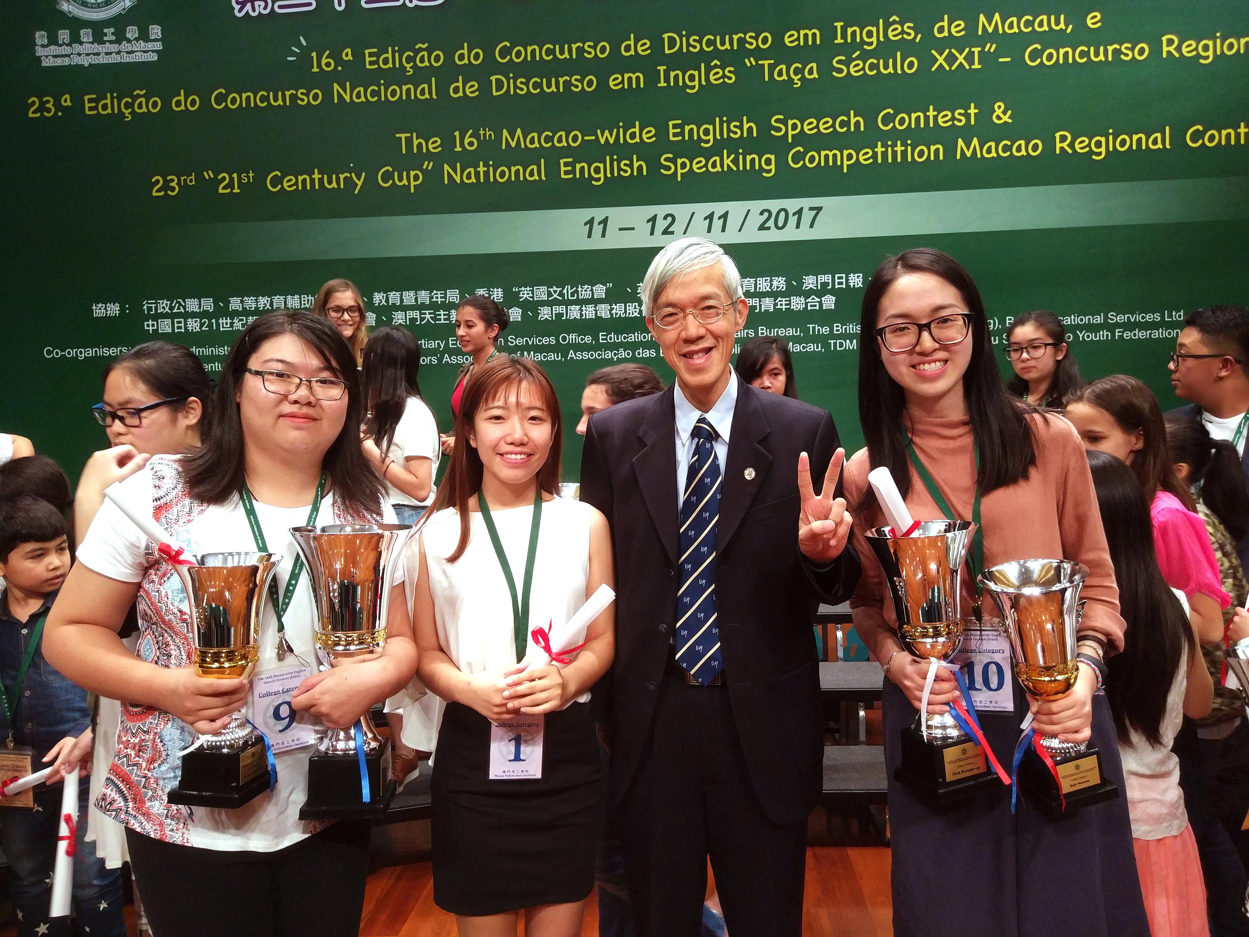 a group photo of the winning students and dean of students paul